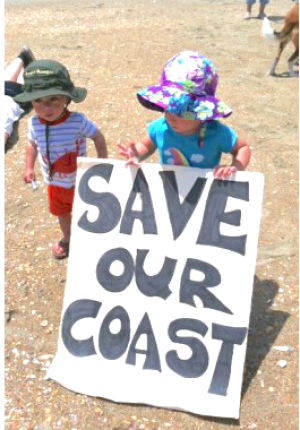 OBX Opposes Offshore Drilling Cora and Sam represent at the 2016 Ocracoke Hands Across the Sand event.